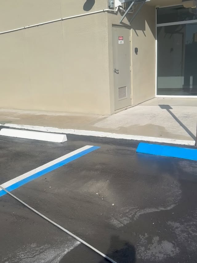 Freshly cleaned commercial parking lot — TitanFlow Exteriors