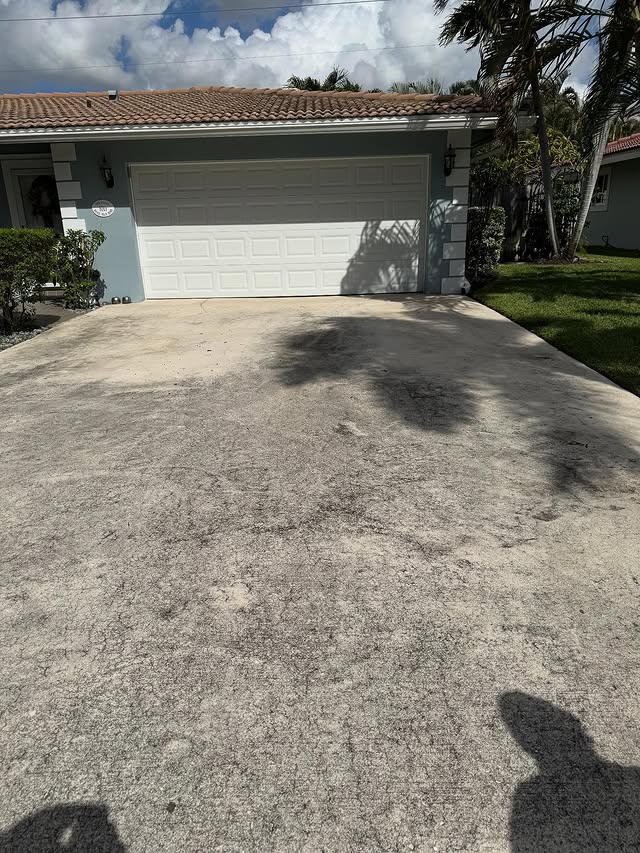 South Florida residential driveway before pressure washing — TitanFlow Exteriors
